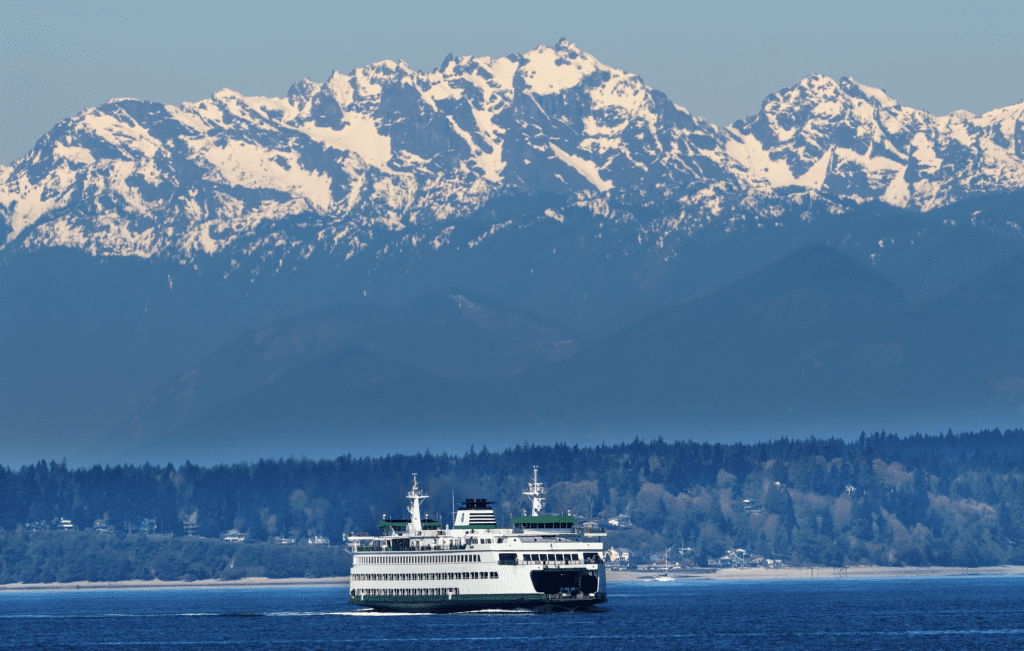 Mountain range in the background with a fairy transporting people around Washington