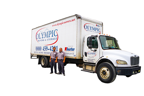 Two Olympic movers standing in front of a branded moving truck in Tacoma