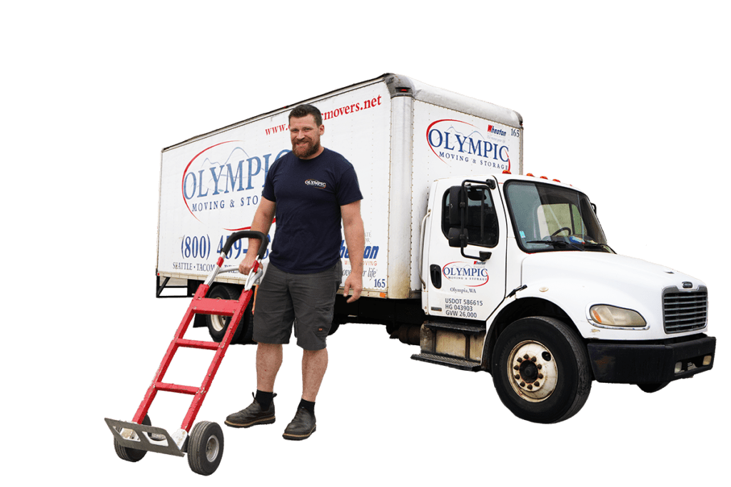 Man holding dolly with a moving truck that says Olympic Moving & Storage