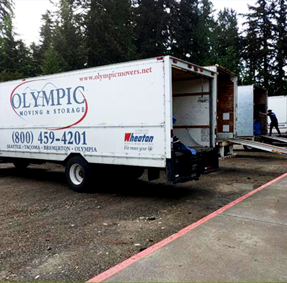 A parked and open Tacoma moving company moving truck, belonging to Olympic Moving & Storage, the best Tacoma movers for you.