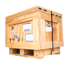 A wooden crate covered in colorful stickers, demonstrating custom crating for interstate and long distance moving.